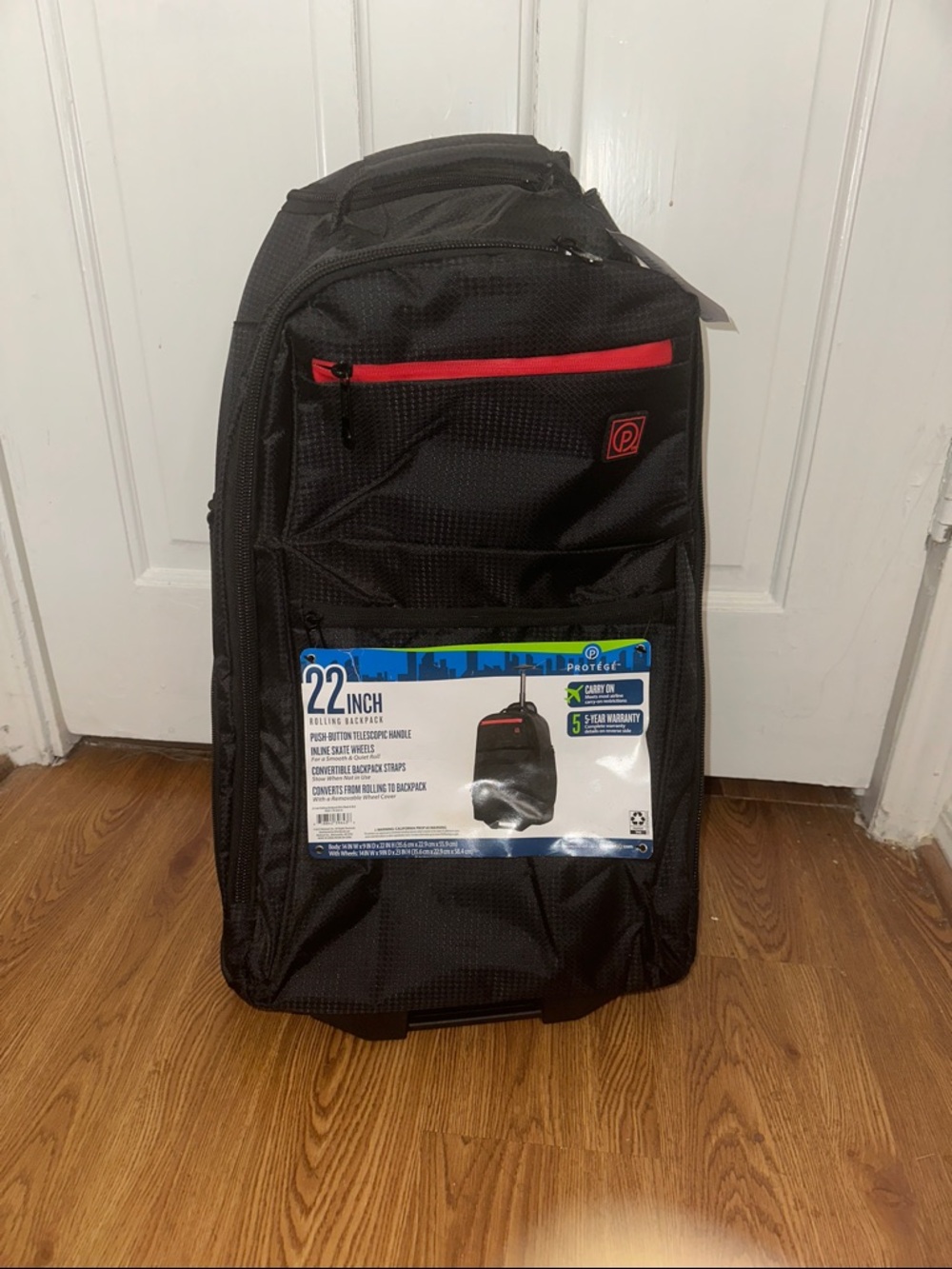 22" Black Carry-On Rolling Backpack with Red Accent
